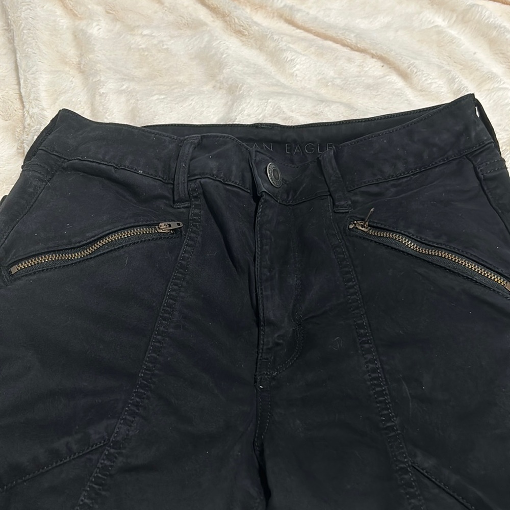 Black jeans with zipper pockets